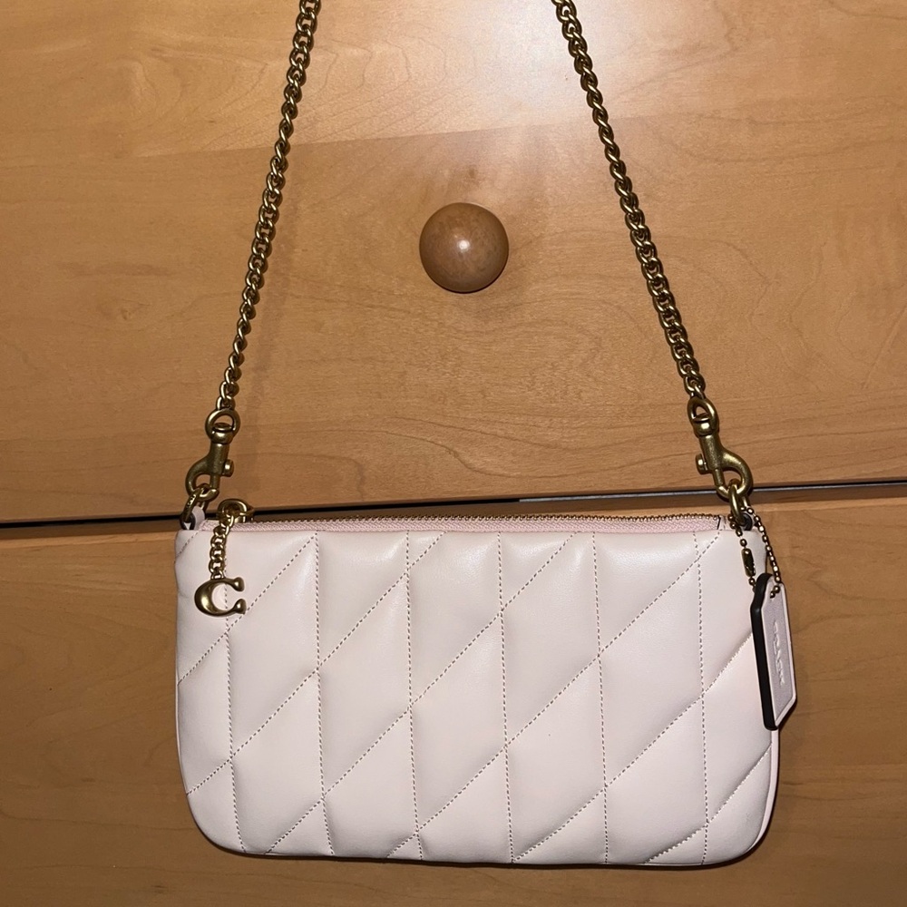 Coach pouch bag with pillow quilting